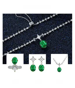 Macro shot of 925 silver emerald-style jewelry set with oval green gems and star zircon detail