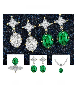 Macro view of emerald green jewelry set including oval ring, necklace and teardrop earrings