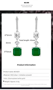 Detail view of 45mm S925 silver emerald earrings with size markers and polished finish