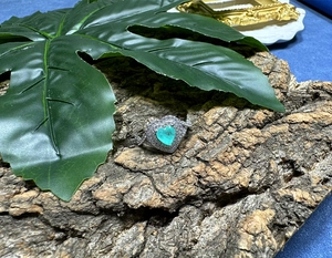Macro detail of heart-shaped Paraiba stone ring with halo zircon in S925 silver