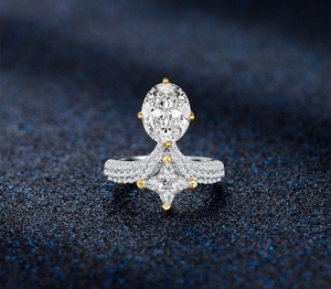 Detailed shot of oval emerald-cut gemstone ring with star accents and pavé diamonds