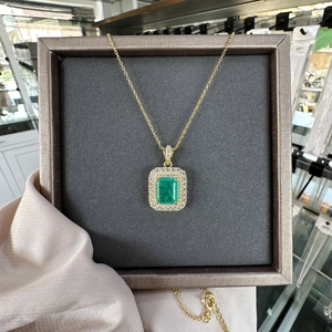 Vintage necklace with 8x10mm emerald-cut green stone and double halo in gold plating