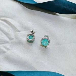 925 silver stud earrings featuring round paraiba synthetic gems with halo diamond accents