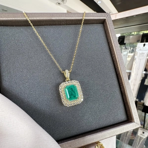 Classic 18k gold plated 925 silver necklace with emerald cut green gemstone and halo diamonds