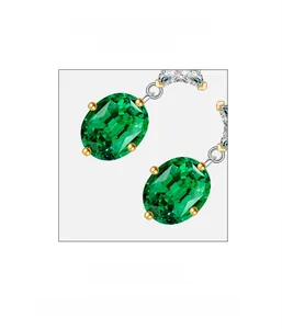 Close-up of oval emerald-cut gemstone earrings with silver frame and small diamond accents