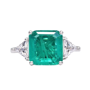 Classic 925 silver ring with large emerald-cut green stone and side triangle zircons
