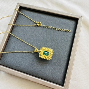 Gold plated 925 silver necklace with rectangular emerald stone and diamond halo