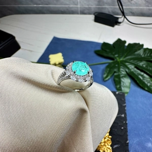 Elegant 8mm mint green oval gemstone ring with 925 silver halo and diamond accents