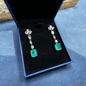 Elegant 8x10mm emerald cut silver drop earrings with marquise stones in a jewelry box