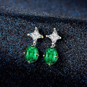Sterling silver oval emerald gemstone drop earrings with diamond-cut accent stones