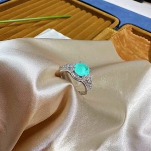 8mm round Paraiba style mint green silver ring with halo stones on champagne silk