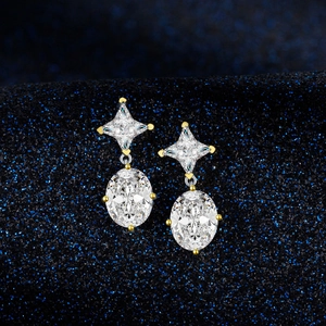 Elegant gold-plated silver earrings with oval and star-cut emerald-style stones