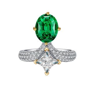 Elegant oval emerald green gemstone ring with square diamond accents and pave band