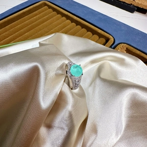 Sterling silver ring featuring 8mm round mint green gemstone and micro-pave crystals