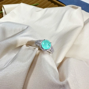 8mm round Paraiba tourmaline style silver ring with pavé stones on silk background