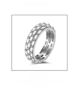 Macro detail of microscopic pave setting and baguette-cut cubic zirconia on silver ring