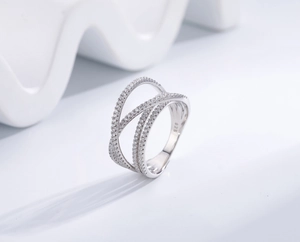 Macro shot of S925 sterling silver ring showing the 925 hallmark and interlaced band