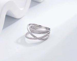 Macro shot of S925 hallmark on crisscross ring band with pavé-set cubic zirconia