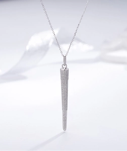 Macro view of a long tapered pendant featuring micro-pave cubic zirconia on a S925 silver chain
