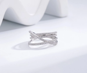 Macro shot of s925 silver ring featuring multi-layered crisscross bands with pavé micro-inlays