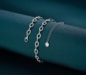 Detailed view of sterling silver Cuban chain with pave stones and S925 hallmark