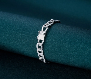 Close-up of silver Cuban link bracelet with micro-paved zircons and secure box clasp
