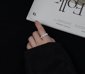 Detail of s925 sterling silver ring with double row of rectangular cut cubic zirconia