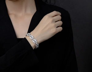 Macro shot of a silver diamond encrusted cuban bracelet showing micro pave diamond details