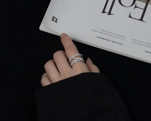 Close-up of S925 sterling silver crisscross multi-layer ring with sparkling zircon stones
