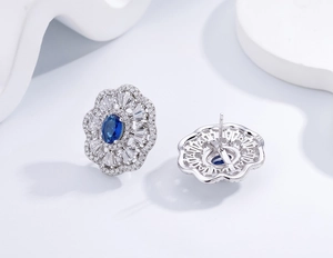 Macro detail showing S925 hallmark on the back of royal blue sapphire flower stud earrings