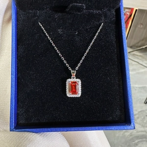 925 silver necklace with rectangular red ruby pendant and zircon in a blue jewelry box