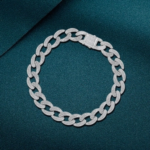 Silver cuban link bracelet for men with micro-pave white zircon crystals on dark background