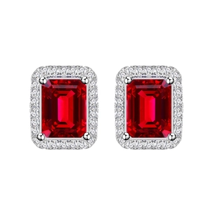 925 silver stud earrings with emerald cut ruby and halo diamond setting on white background