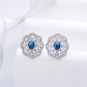 Elegant 925 sterling silver floral stud earrings with oval blue sapphire and zircon