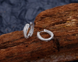 Close-up of Mobius hoop earrings in S925 sterling silver with micro-pave white zircons