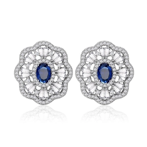 Oval royal blue sapphire earrings with halo of diamonds in 925 sterling silver