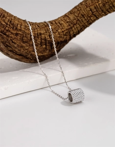 Detail of S925 sterling silver cylinder pendant necklace with pave micro-set zircons
