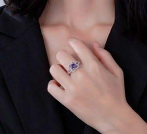 Macro shot of 925 silver ring featuring purple oval stone and intricate floral pave detail