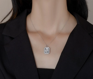 Detailed close-up of a square mother-of-pearl cloud pendant on a S925 silver chain