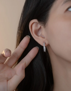 Close-up of S925 sterling silver hoop earrings with double row sparkling pavé zircons