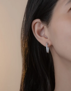 Detail of silver S925 sterling silver hoop earrings with double row pavé zircons