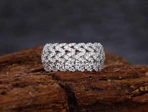 Macro view of S925 sterling silver V-shape wide band ring with pavé micro-set cubic zirconia