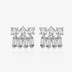Macro detail of S925 sterling silver stud earrings with sparkling baguette-cut zircons