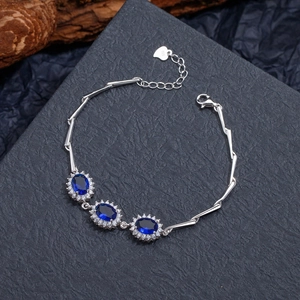 Elegant S925 sterling silver bracelet with oval blue sapphire and zirconia accents
