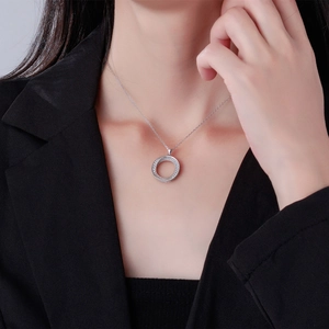S925 sterling silver Mobius double ring necklace with sparkling zircon pave on a female model