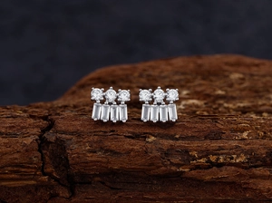 Macro shot of S925 sterling silver stud earrings with round and rectangular cubic zirconia