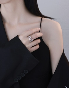 Detailed view of wide hollow wavy S925 silver ring with full micro-paved sparkling crystals