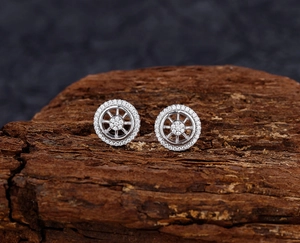 Close-up of S925 sterling silver dreamcatcher stud earrings with pavé zircon accents