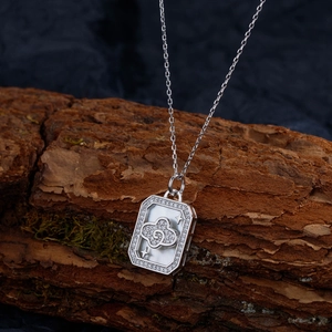 Elegant S925 silver necklace with rectangular diamond cloud pendant on rustic wood background