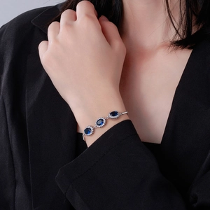 Elegant S925 sterling silver bracelet featuring three oval blue sapphire gemstones for women
